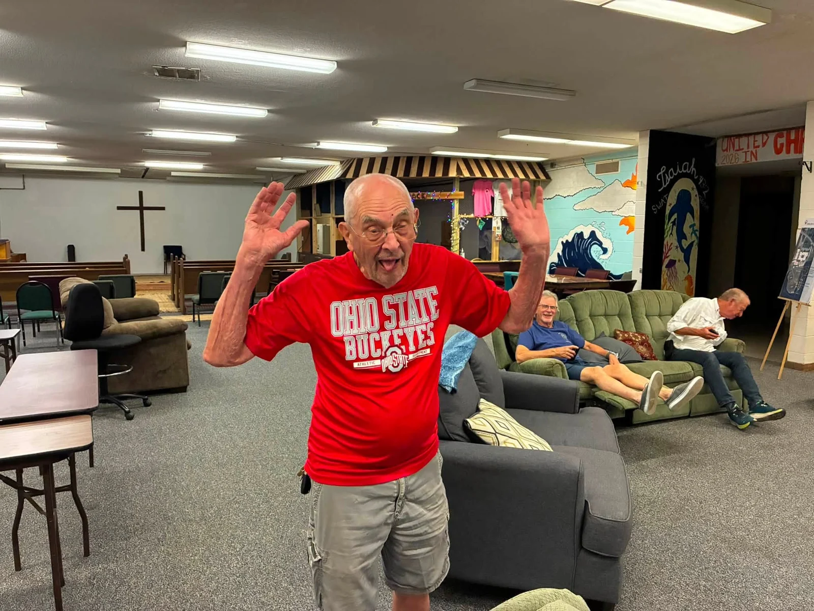 A participant sharing a cheerful moment in the common room